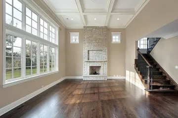 Repaired and refinished hardwood floor in a formal living room