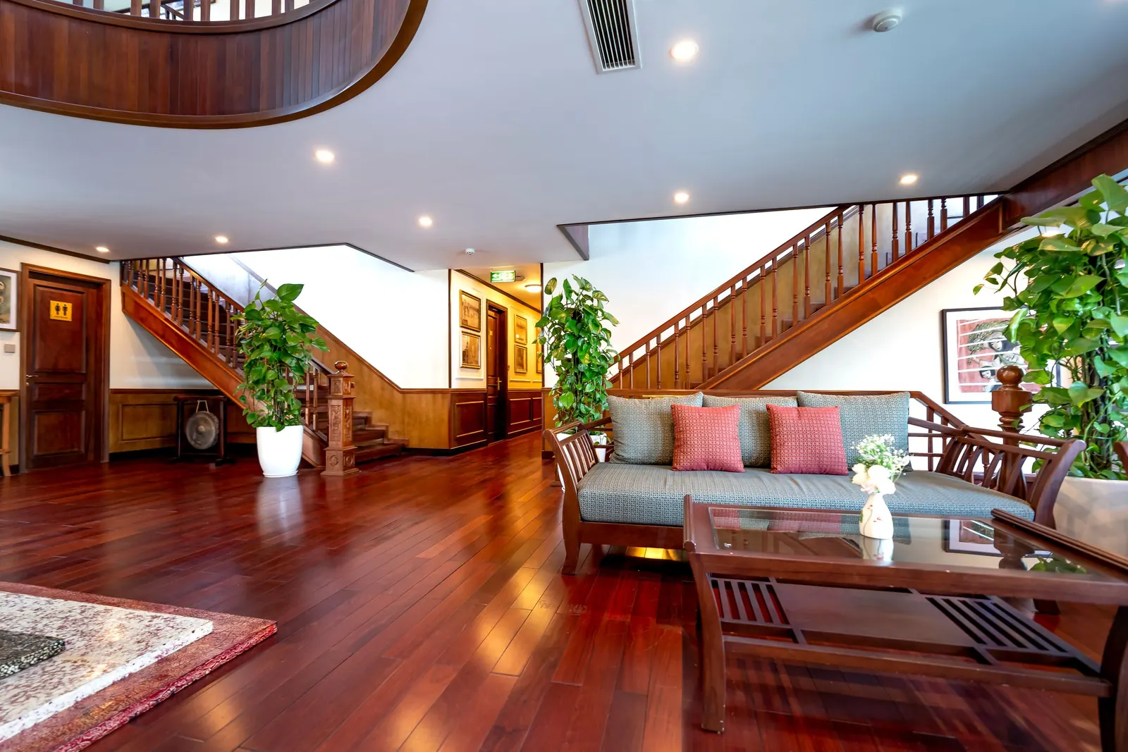 Hardwood staircase in an open foyer in Highland, CA